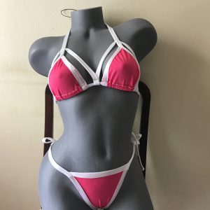 Hot pink bikini with white trim and strappy detailing