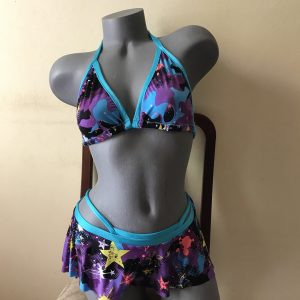 Star print bikini with turquoise trim, triangle halter top, and skirted bottom