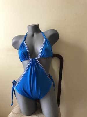 Bright blue halter monokini with white and blue gingham trim and side ties