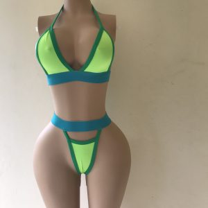Voltage bikini in neon green with turquoise trim and high-cut thong design – front view on mannequin