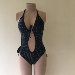 Charcoal Fire black one-piece swimsuit with rhinestone details, plunging cut-out, and tie straps – front view on mannequin