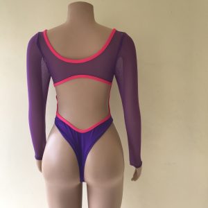 Rebel one-piece swimsuit in purple with hot pink trim, thong back, and long mesh sleeves – back view on mannequin