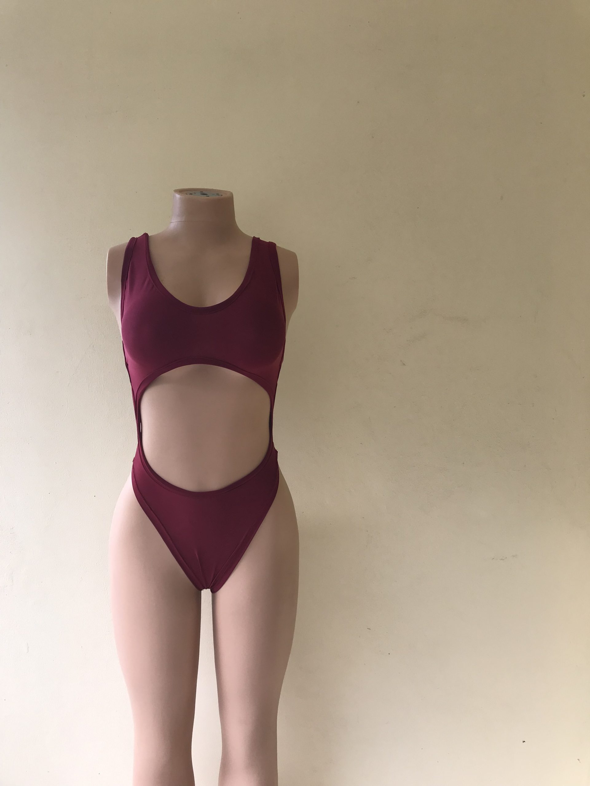 Obsession burgundy cut-out one-piece swimsuit with high-cut legs – front view on mannequin
