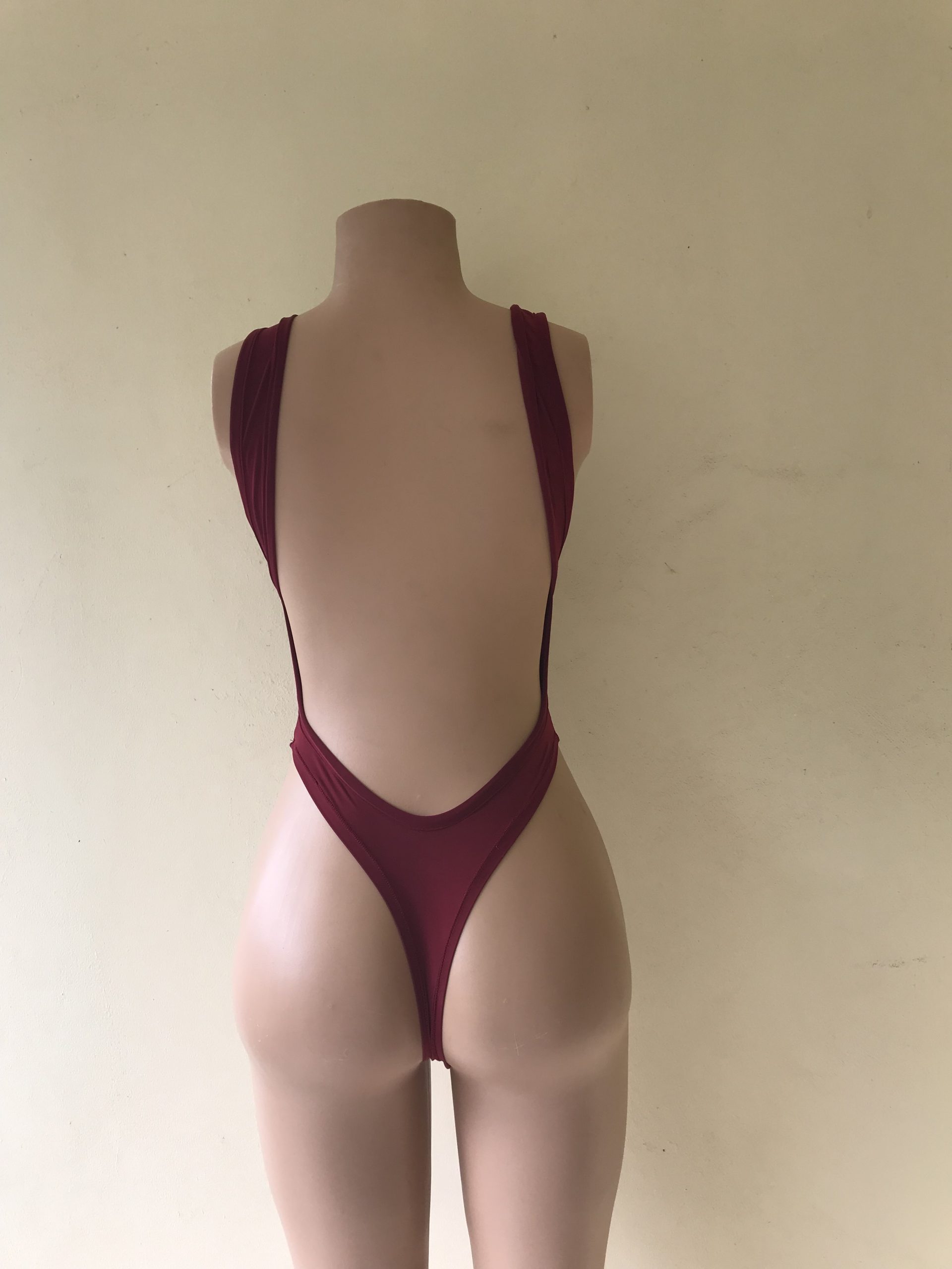 Obsession burgundy cut-out one-piece swimsuit with plunging open back – back view on mannequin