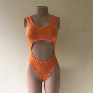 Temptress. A one-piece swimsuit in bright orange with bold midriff cut-out – front view on mannequin