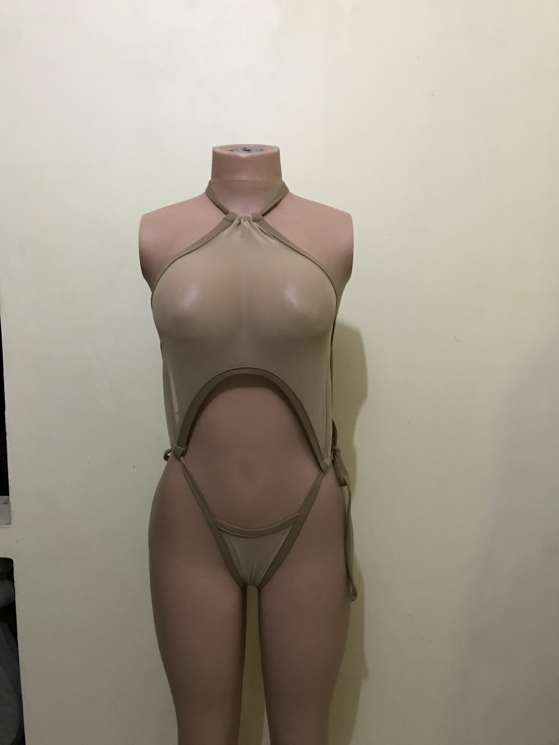 Nude mesh halter monokini with cut-out and thong bottom, front view on mannequin