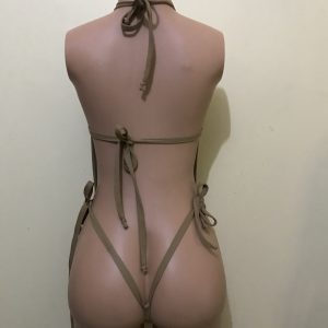 Nude mesh halter monokini with tie-back straps and thong bottom, back view on mannequin