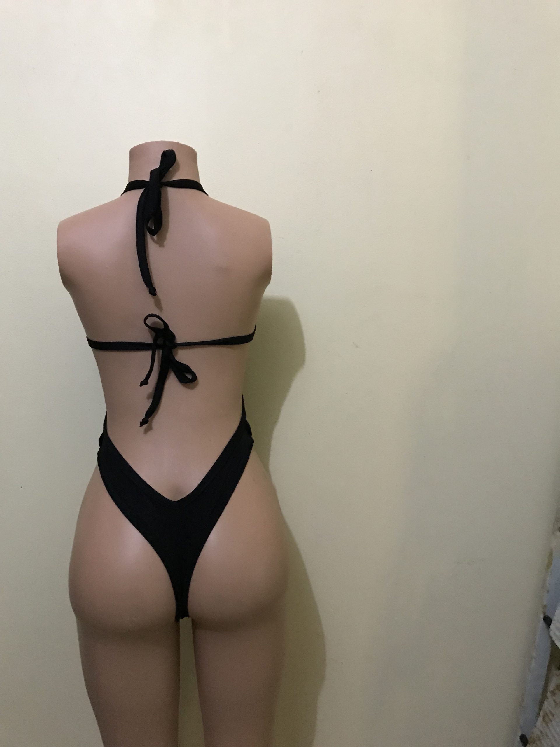 Black halter bikini with tie-back straps, back view on mannequin